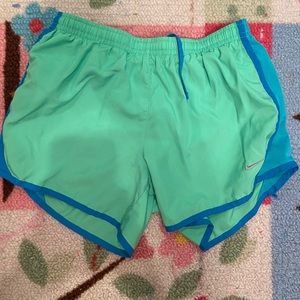 green and blue nike shorts